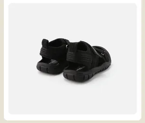 Rear view detail of black kids sports sandals showing heel support and soft rubber sole