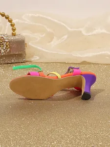 Detailed side view of colorful lace-up high-heeled sandals with a purple chunky heel.