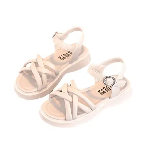 Elegant cream white girls sandals featuring a soft sole and stylish cross strap design