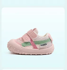 Side view of pink mesh toddler sneaker with soft rubber sole and hook-and-loop closure