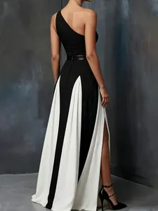 Elegant one-shoulder black and white color-block maxi dress with high side slit detail