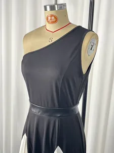 Close-up detail of an elegant black and white one-shoulder dress on a mannequin form