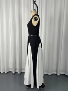 Detailed side profile of an elegant black and white color-block maxi dress on a mannequin