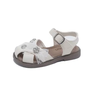 Elegant off-white girl's princess sandals with lace bow and flower decor for summer