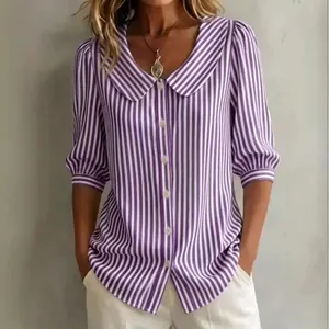 Detail of purple and white striped blouse with puff sleeves and Peter Pan collar