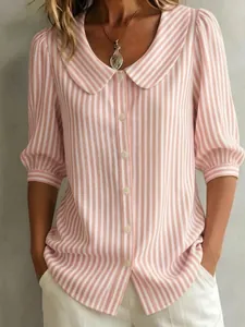Close-up of women's pink striped blouse with Peter Pan collar and puff sleeves.