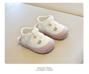 Detailed view of white and pink closed-toe toddler sandals with breathable holes