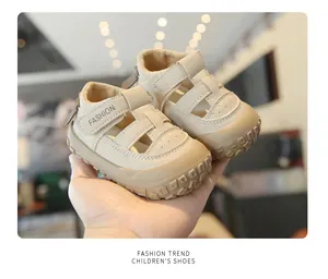 Detail view of beige children's closed-toe sandals with breathable design for summer