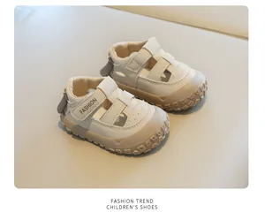 Detail view of beige children's closed-toe sandals with non-slip rubber soles