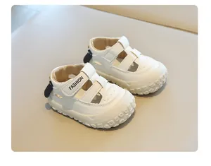 Detailed view of white closed-toe toddler sandals with adjustable velcro strap