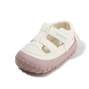 White and pink breathable baby walking sandals with anti-slip closed-toe design for toddlers