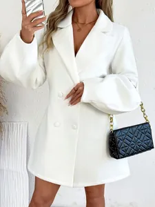 Detail view of a white retro court style wool coat with lantern sleeves and large lapels.
