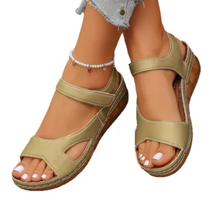 Stylish metallic wedge sandals for women with adjustable velcro straps and open toe.