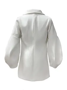 Detailed back view showing the structure of lantern sleeves on a white wool coat
