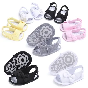 Close-up of assorted baby bow-knot sandals featuring soft soles in multiple colors