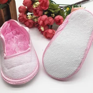 Sweet pink infant pre-walker shoes featuring non-slip soft soles and delicate lace lining