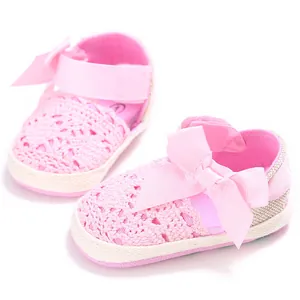 Pink hollow lace baby walking shoes with cute ribbon bow and breathable soft sole detail