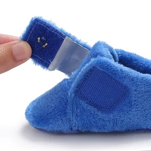 Close-up of soft plush baby shoe featuring a convenient Velcro strap closure