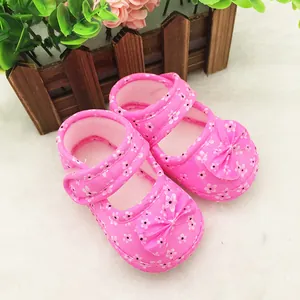 Detailed view of pink floral baby shoes with non-slip soft soles for infants