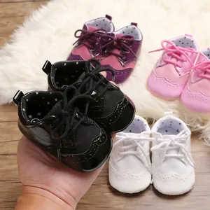 Detailed view of various colors of soft-sole baby walking shoes on a plush rug.