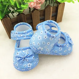 Soft light blue floral baby walking shoes featuring anti-slip soles and cute bow details
