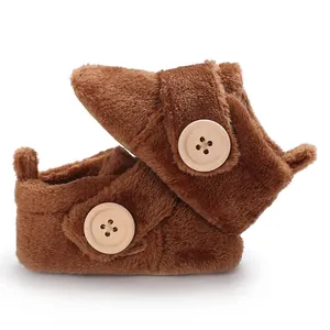 Soft brown plush baby pre-walker shoes with decorative wooden button for 0-1 year old infants