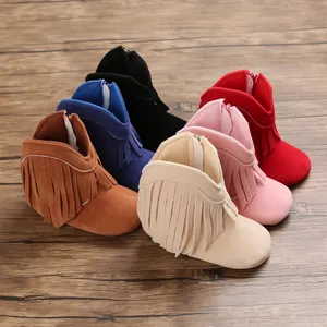 Detailed close-up showing a variety of colorful fringe tassels on baby walking boots