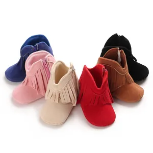 Colorful group of baby fringe boots in pink, red, beige, blue, brown, and black.