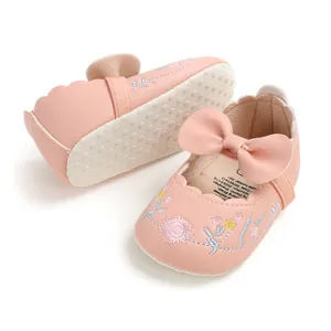 Detailed view of pink baby princess shoes featuring floral embroidery and soft non-slip soles