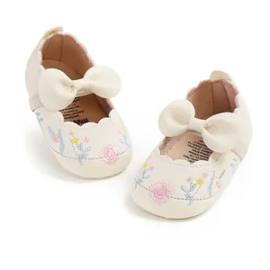 Retro embroidered baby princess shoes featuring delicate floral patterns and cream bows
