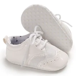 White elegant infant pre-walker leather shoes featuring anti-slip soft soles and lace-up design