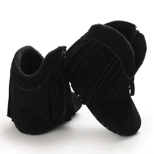 Detailed close-up of black suede baby fringe boots with side zipper for 0-1 year olds