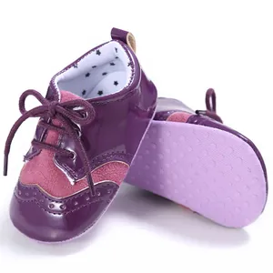 Close-up of purple baby walking shoes with soft non-slip sole and matte fabric details