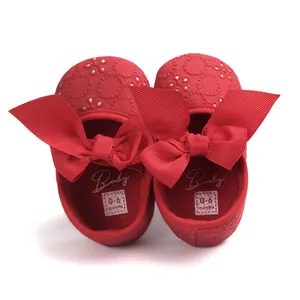 Red embroidered baby princess shoes with soft soles and decorative large ribbon bows