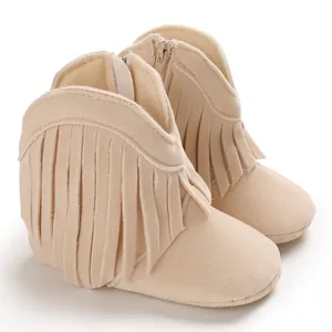 Detailed side view of beige suede baby boots featuring stylish fringe accents for infants