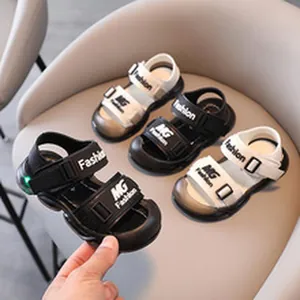 Close-up of children's sports sandals with LED lights and adjustable straps.