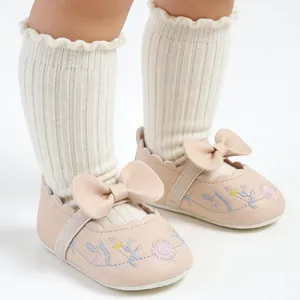 Vintage style pink baby princess shoes featuring delicate floral embroidery and large bow