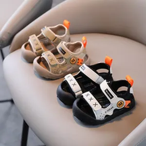 Close-up detail of children's sports sandals in stylish beige and black colors