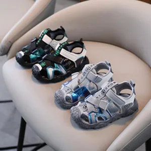Detail view of children's sporty sandals featuring black/green and grey/blue variants