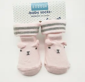 Pink baby socks with animal face and anti-slip dots for 0-6 months