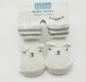 White combed cotton baby socks featuring a bear face design for newborns aged 0-6 months