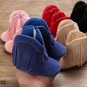 Close-up of colorful baby tassel boots showing soft texture and multiple color options.