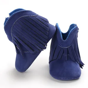 Detailed view of dark blue suede baby boots with stylish fringe and side zipper