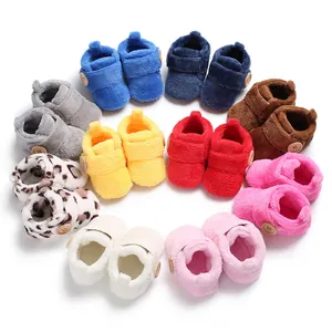 Cozy plush baby walker shoes in various colors with decorative wooden buttons for infants