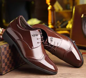Polished brown men's height increasing dress shoes with elegant lace-up closure detail