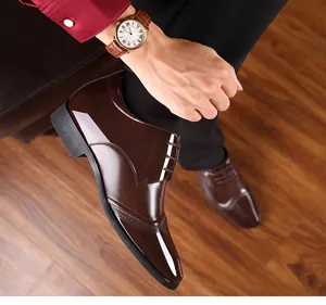 Macro detail of glossy brown British style men's 8cm invisible heightening dress shoes