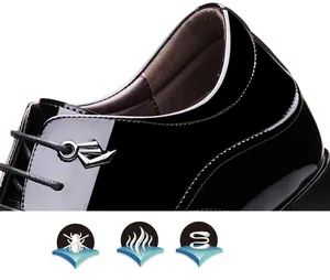 Close-up detail of glossy black patent leather finish on men's formal elevator dress shoes