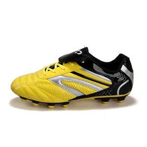 Chaussures de football pour enfants jaune et noir avec bandes argentées et crampons