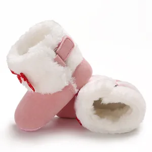 Botas de nieve rosas para bebé con forro de pelo blanco y lazo rojo para invierno