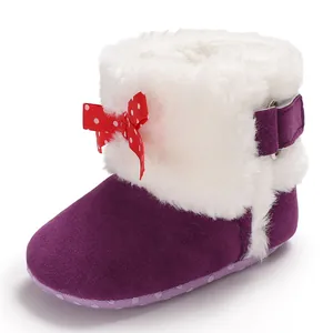 Botas de nieve moradas para bebé con pelo sintético blanco y lazo rojo de lunares